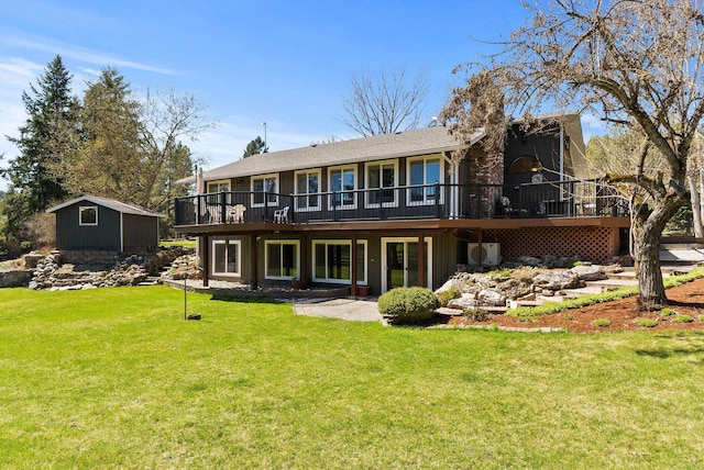 back of house with a lawn and a deck