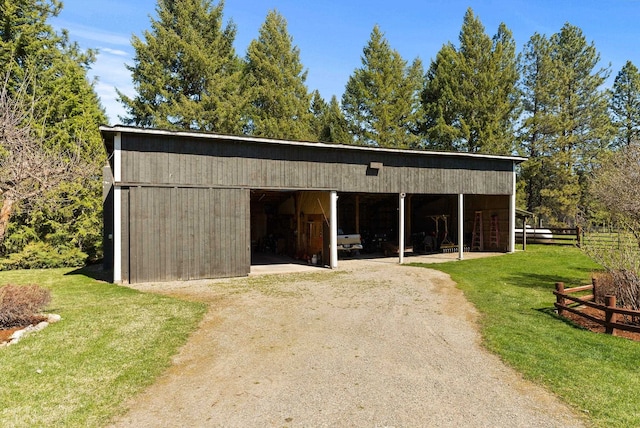 exterior space featuring a lawn and fence