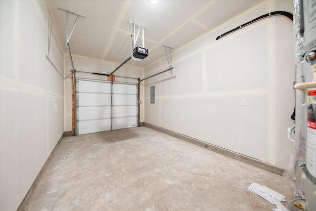 garage featuring a garage door opener and baseboards