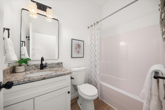 bathroom with shower / tub combo with curtain, wood finished floors, toilet, and vanity