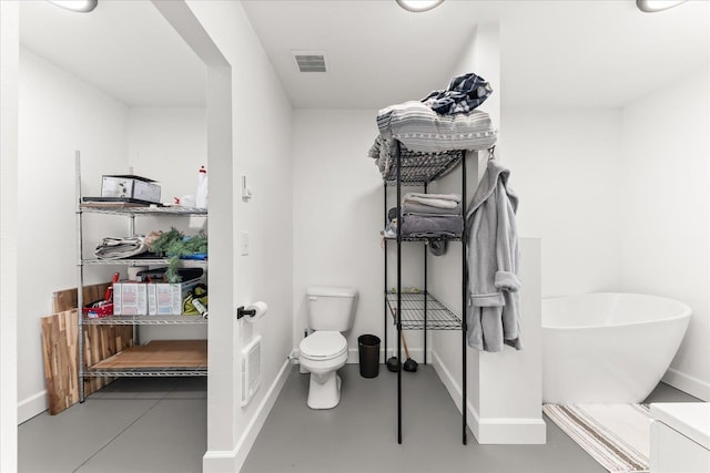 40359 Barbara Ln, Davenport, WA 99122 - bathroom with baseboards, toilet, and visible vents