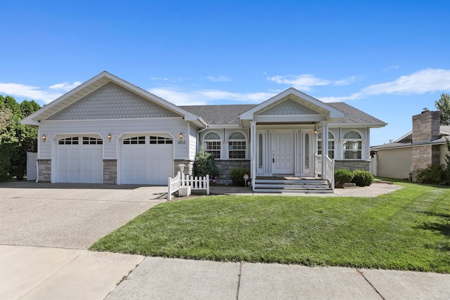 single story home with a shingled roof, an attached garage, driveway, stone siding, and a front yard