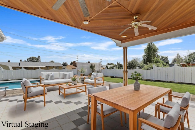 view of patio / terrace with an outdoor hangout area, a fenced in pool, a fenced backyard, and ceiling fan
