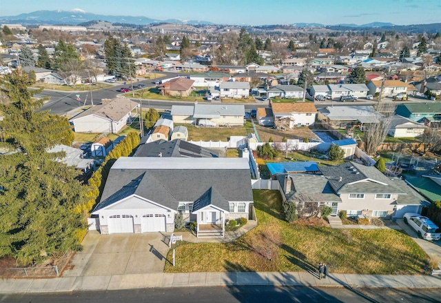 birds eye view of property with a residential view and a mountain view