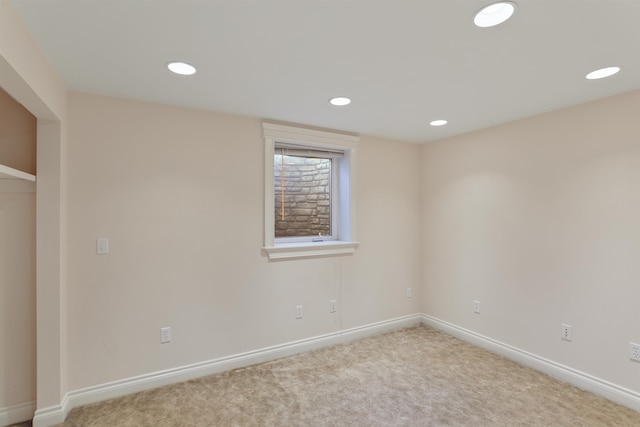 empty room with recessed lighting, carpet floors, and baseboards