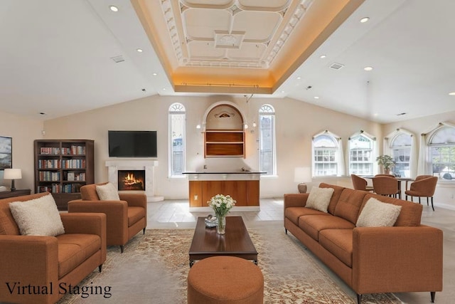 living area with vaulted ceiling, a warm lit fireplace, a raised ceiling, baseboards, and recessed lighting
