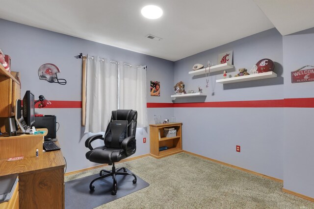 carpeted office space featuring baseboards and visible vents