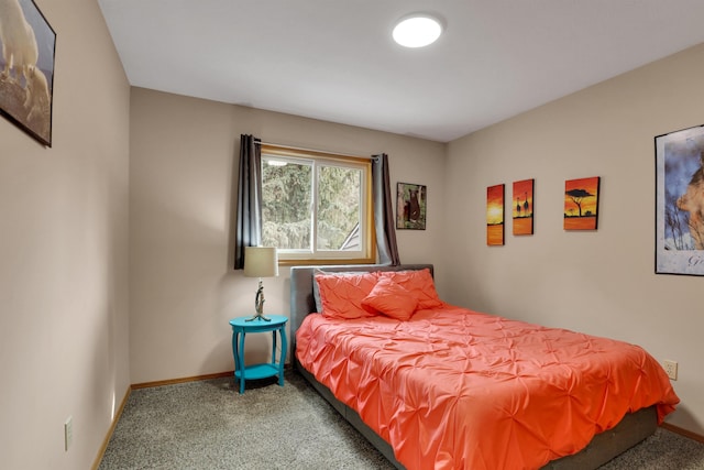 carpeted bedroom with baseboards