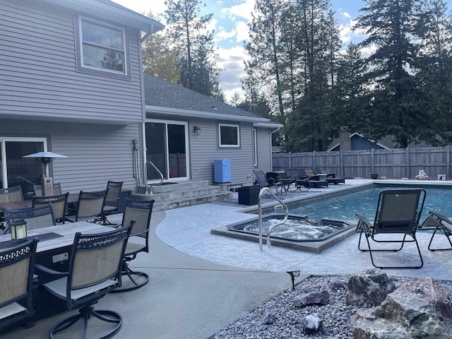 view of pool featuring a fenced backyard, a patio, a fenced in pool, and outdoor dining area