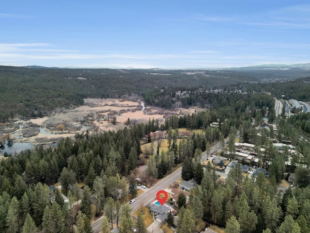 bird's eye view featuring a forest view and a mountain view