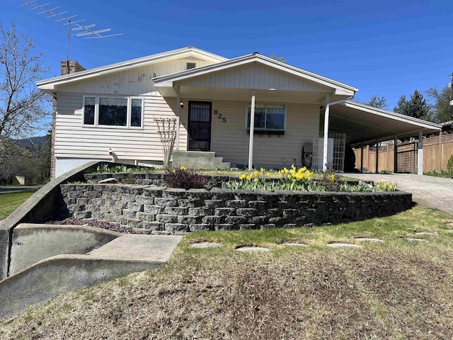 825 N Jefferson St, Colville, WA 99114 - view of front of property featuring driveway, a chimney, a carport, and fence
