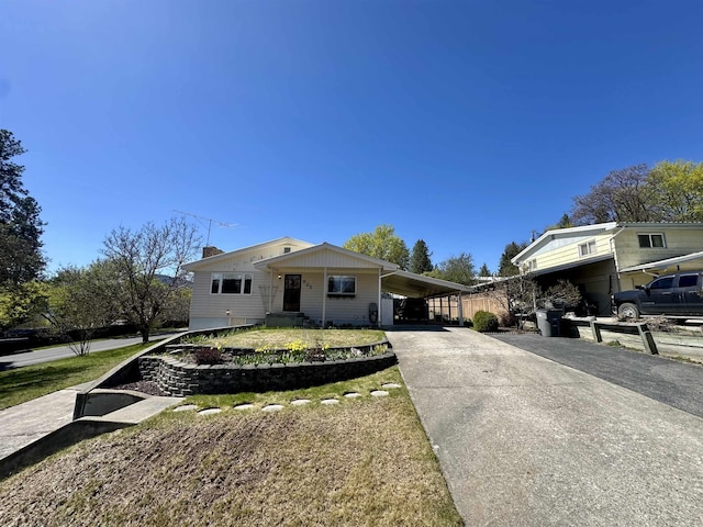 825 N Jefferson St, Colville, WA 99114 - view of front of home featuring a carport and driveway