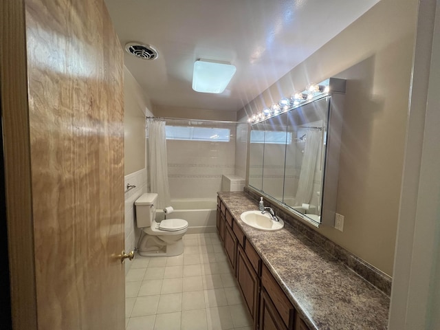 825 N Jefferson St, Colville, WA 99114 - full bathroom featuring tile patterned floors, vanity, shower / tub combo, toilet, and visible vents