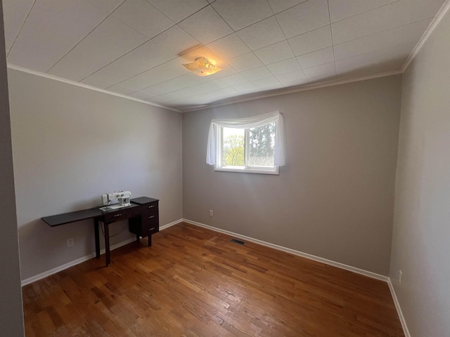 825 N Jefferson St, Colville, WA 99114 - unfurnished room featuring visible vents, baseboards, wood finished floors, and ornamental molding