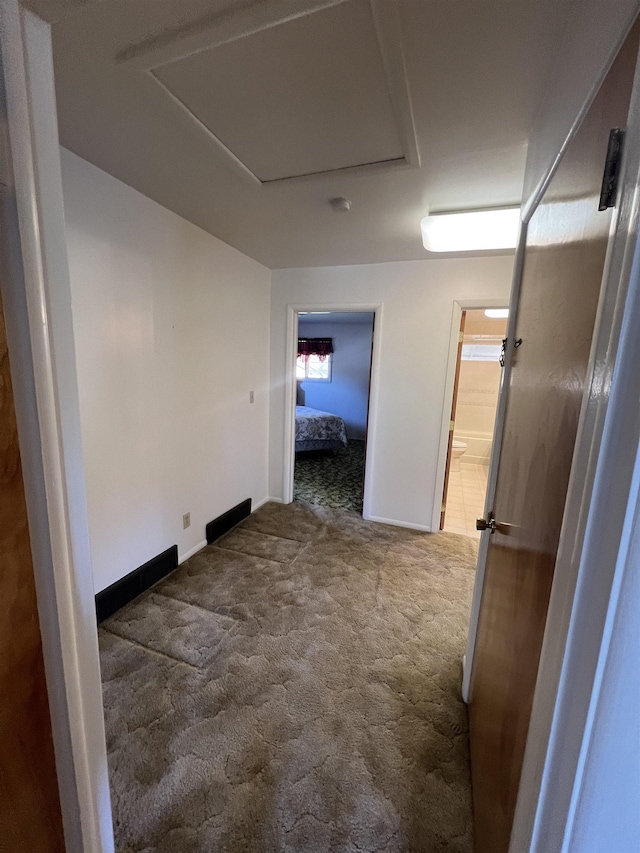 825 N Jefferson St, Colville, WA 99114 - corridor with baseboards and carpet flooring