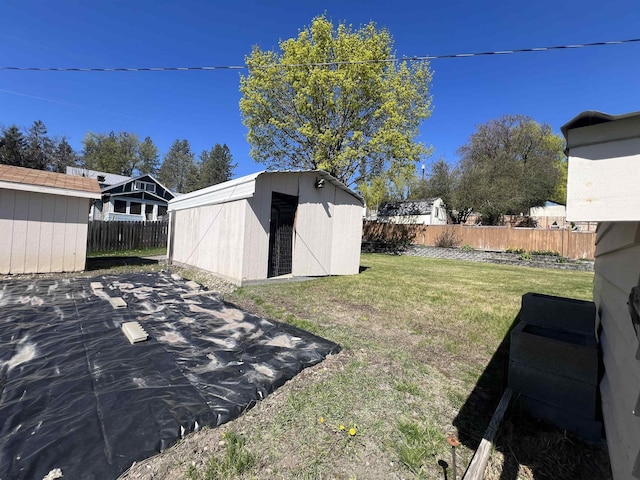 825 N Jefferson St, Colville, WA 99114 - view of yard featuring a fenced backyard, an outdoor structure, and a shed