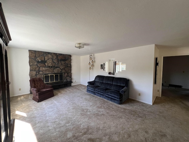 825 N Jefferson St, Colville, WA 99114 - living room with baseboards, a stone fireplace, carpet floors, and a textured ceiling