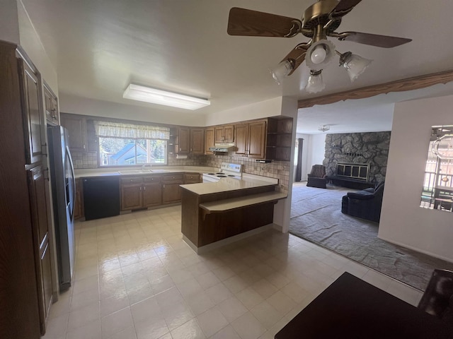 825 N Jefferson St, Colville, WA 99114 - kitchen with under cabinet range hood, stainless steel fridge with ice dispenser, a peninsula, electric range, and open floor plan