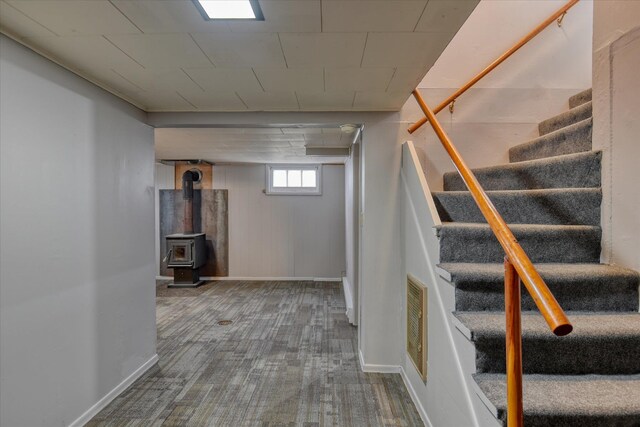403 W Chestnut St, Almira, WA 99103 - basement with stairway, baseboards, carpet flooring, and a wood stove