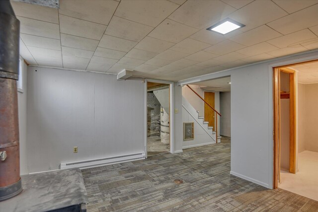 403 W Chestnut St, Almira, WA 99103 - finished below grade area with a baseboard heating unit, stairway, and carpet