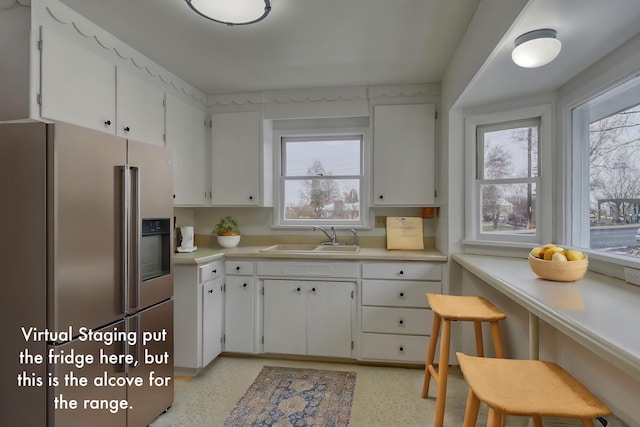 403 W Chestnut St, Almira, WA 99103 - kitchen featuring stainless steel refrigerator with ice dispenser, a sink, healthy amount of natural light, and light countertops
