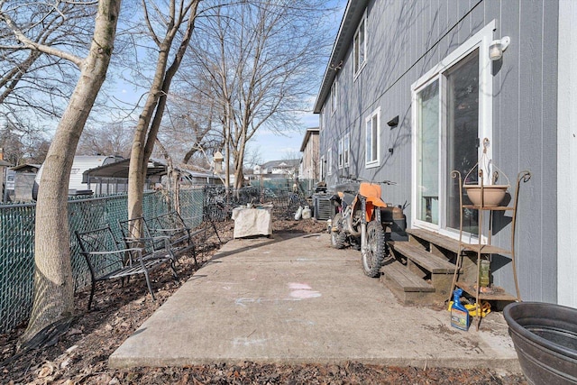 view of patio featuring a fenced backyard and central AC