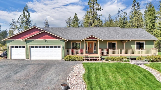 5818 S Abbott Rd, Spokane, WA 99224 - ranch-style house featuring an attached garage, driveway, a front lawn, and a shingled roof