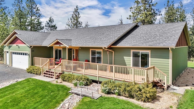 5818 S Abbott Rd, Spokane, WA 99224 - ranch-style home with an attached garage, a porch, and a shingled roof