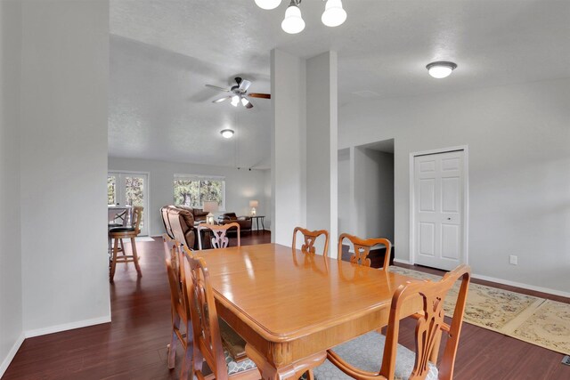 5818 S Abbott Rd, Spokane, WA 99224 - dining room with lofted ceiling, a ceiling fan, baseboards, wood finished floors, and a chandelier