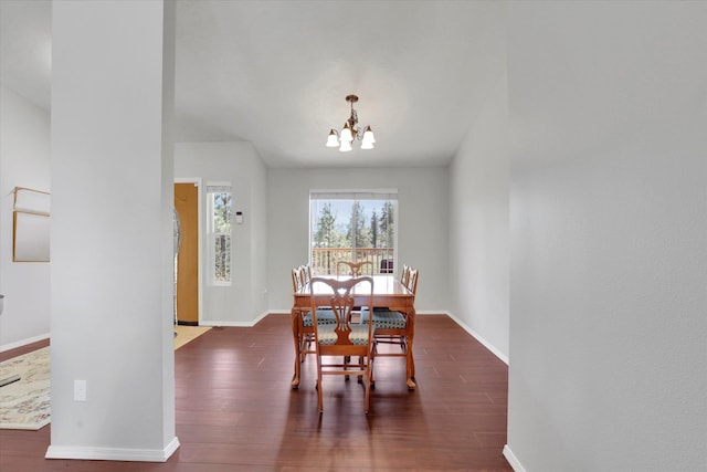 5818 S Abbott Rd, Spokane, WA 99224 - dining room featuring a chandelier, baseboards, and wood finished floors