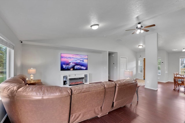 5818 S Abbott Rd, Spokane, WA 99224 - living area with lofted ceiling, dark wood finished floors, ceiling fan, baseboards, and a fireplace