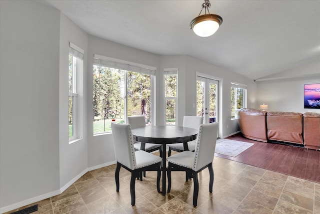 5818 S Abbott Rd, Spokane, WA 99224 - dining space with baseboards and vaulted ceiling