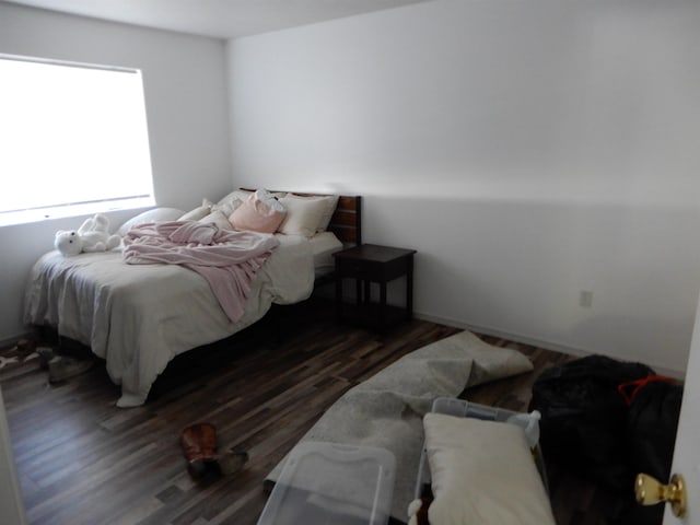 bedroom featuring wood finished floors