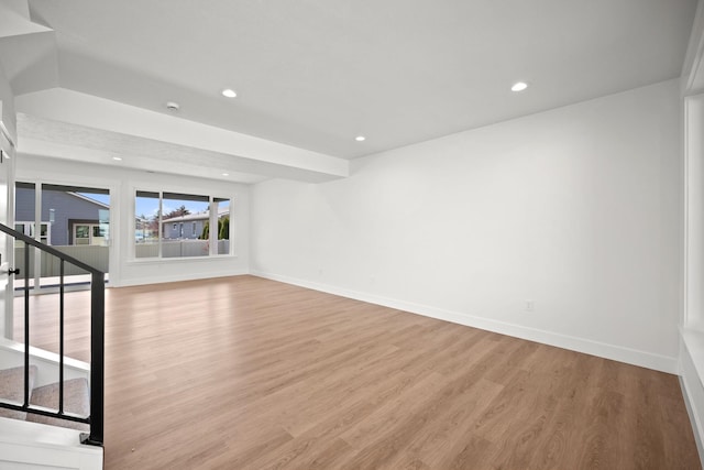 interior space with stairway, baseboards, wood finished floors, and recessed lighting