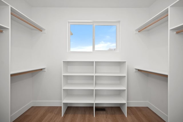 spacious closet with wood finished floors