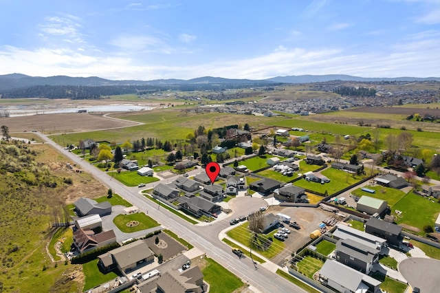 birds eye view of property with a mountain view