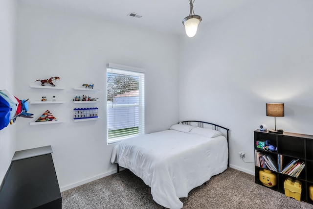 bedroom with baseboards, visible vents, and carpet flooring