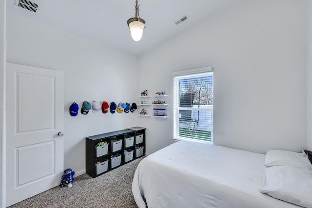bedroom featuring lofted ceiling, baseboards, visible vents, and carpet