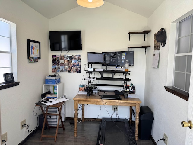 office space with baseboards, vaulted ceiling, and wood finished floors
