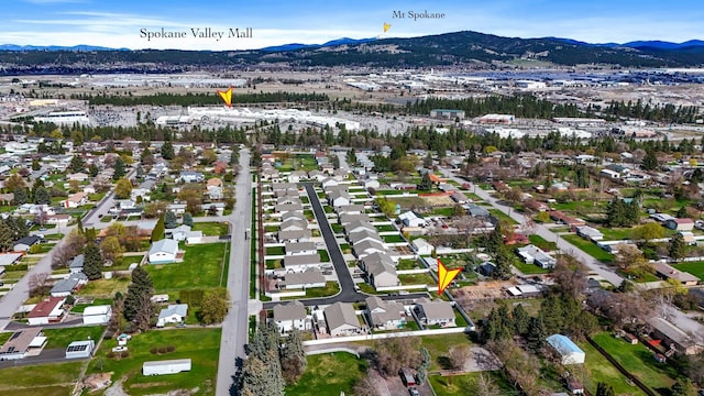 aerial view with a mountain view and a residential view
