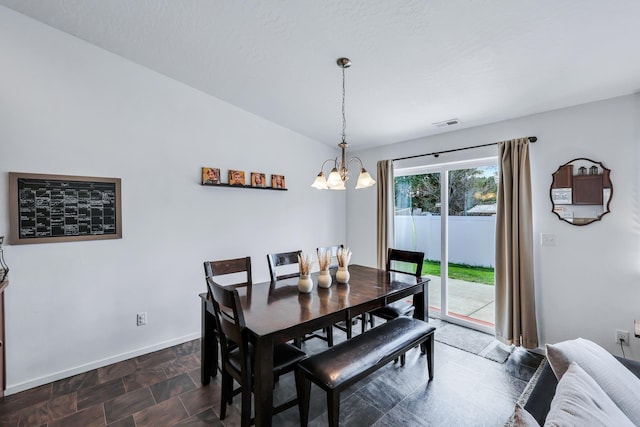 dining space featuring baseboards, a notable chandelier, and visible vents