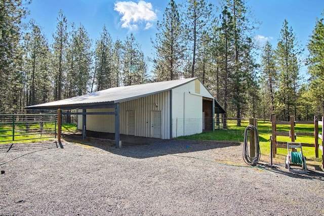 21203 W Beechwood Rd, Medical Lake, WA 99022 - view of outdoor structure with an outbuilding, an exterior structure, a carport, and driveway