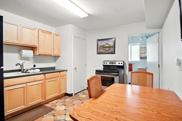 21203 W Beechwood Rd, Medical Lake, WA 99022 - kitchen featuring light brown cabinetry, stainless steel electric range, a sink, and dark countertops