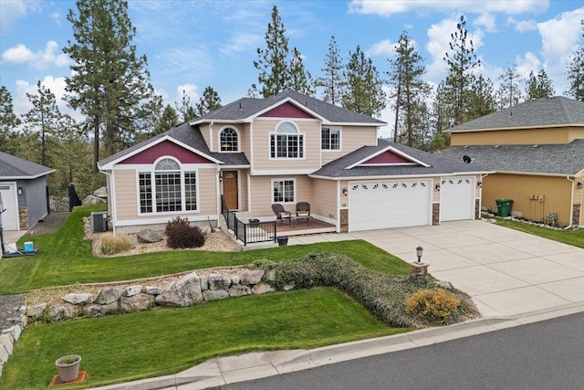 28 E Lindsey Ln, Spokane, WA 99208 - traditional-style house with a garage, central AC, driveway, and a front yard