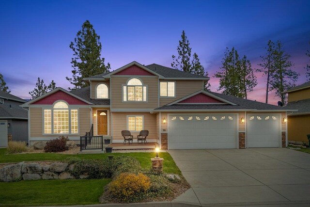28 E Lindsey Ln, Spokane, WA 99208 - view of front of property featuring concrete driveway, an attached garage, a yard, and roof with shingles