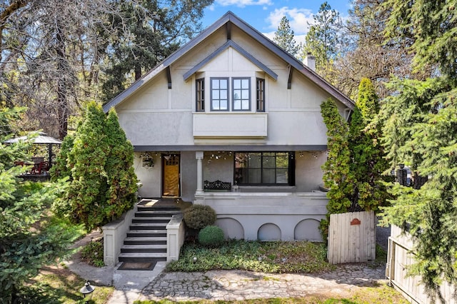 1106 S Freya St, Spokane, WA 99202 - view of property hidden behind natural elements featuring stairway, a fenced front yard, and a gate