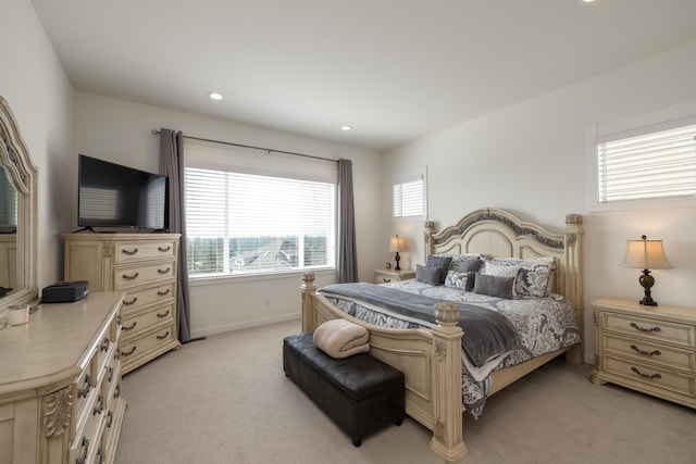 bedroom with recessed lighting, baseboards, and light carpet