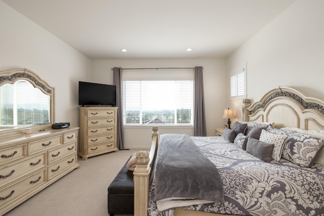 bedroom with light carpet and recessed lighting
