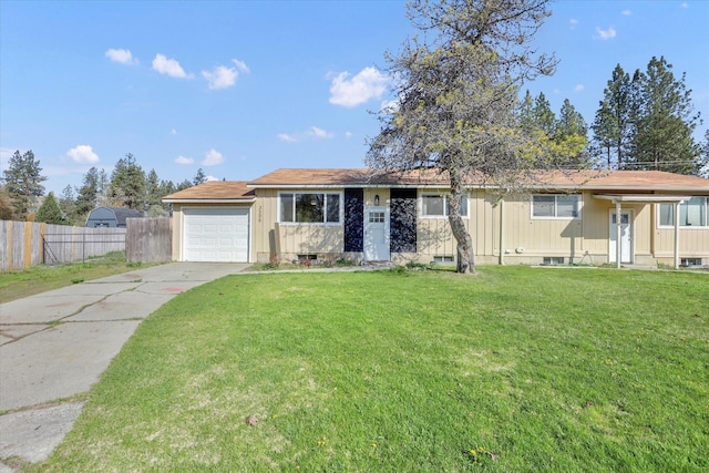 ranch-style home with fence, a front lawn, driveway, and a garage