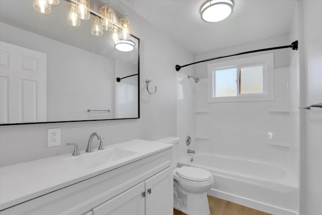 full bath featuring wood finished floors, vanity,  shower combination, and toilet